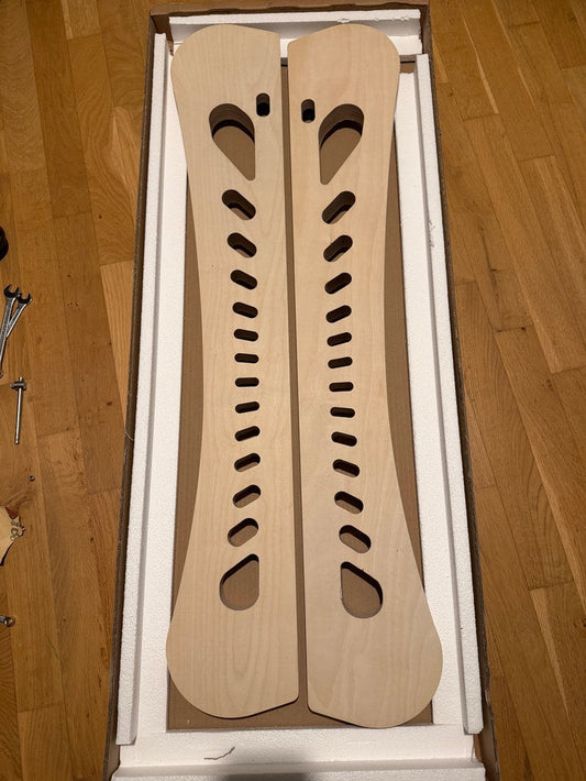 The two milled side elements for the first pre-production prototype, unpainted, lying in their packaging