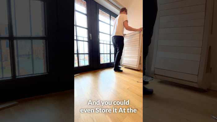 The Office Walker stored upright against a wall