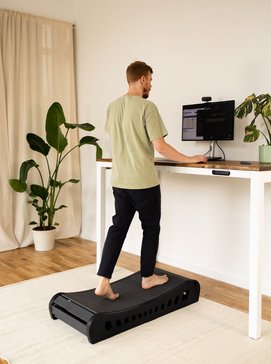 Black wood, at a standing desk